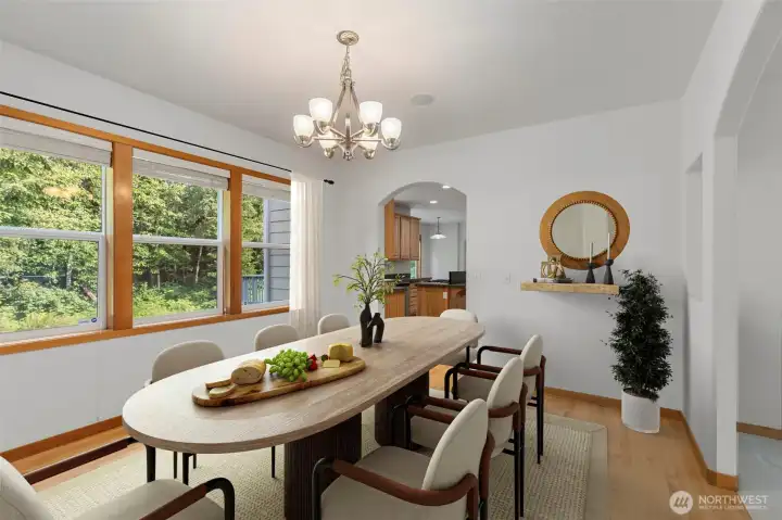 Room for a full table and then some — the dining room connects directly to the kitchen through an arched pass-through. Virtually stage Room for a full table and then some — the dining room connects directly to the kitchen through an arched pass-through. Virtually stage