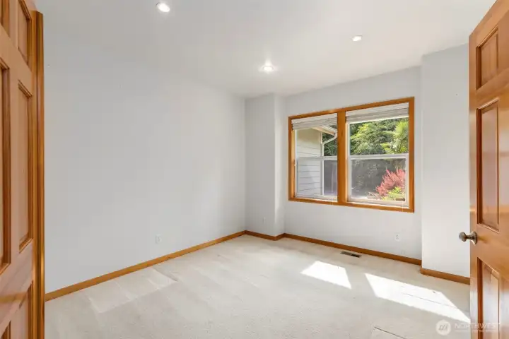 Quiet, carpeted, and filled with natural light — this main floor room works as an office, or guest space depending on your needs. Fir french doors. Quiet, carpeted, and filled with natural light — this main floor room works as an office, or guest space depending on your needs. Fir french doors.