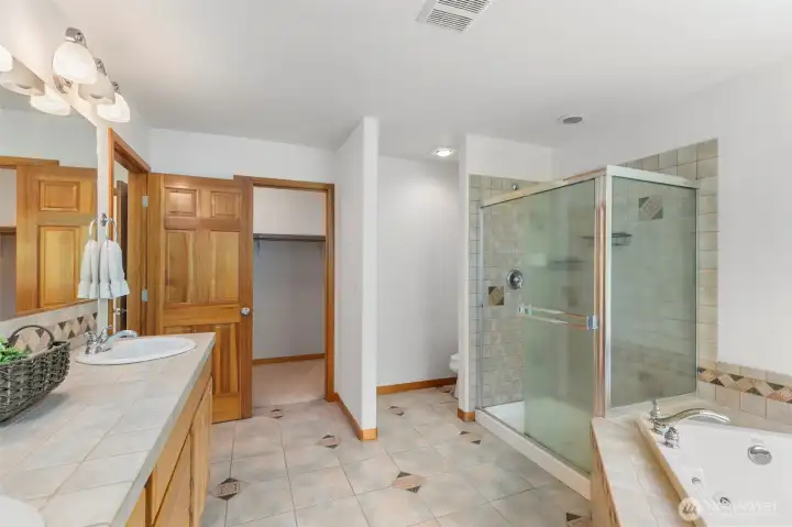 The primary bath offers a double vanity, walk-in shower, soaking tub, and direct access to the walk-in closet — everything laid out thoughtfully in one connected space. The primary bath offers a double vanity, walk-in shower, soaking tub, and direct access to the walk-in closet — everything laid out thoughtfully in one connected space.
