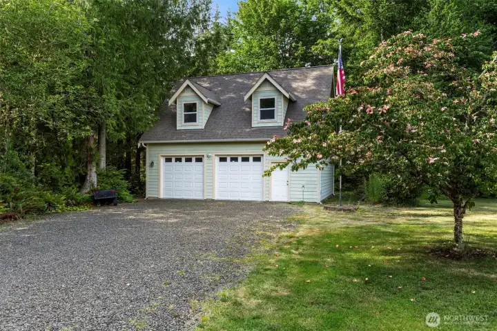 The 772 sq ft detached two-car garage built in 2007 is a well-proportioned structure in its own right — with dormer windows hinting at the potential waiting upstairs. The 772 sq ft detached two-car garage built in 2007 is a well-proportioned structure in its own right — with dormer windows hinting at the potential waiting upstairs.