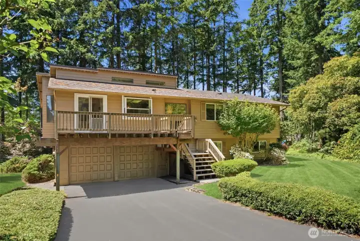 Broad driveway and 2-car garage.