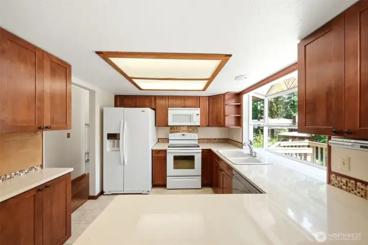 Remodeled kitchen with quartzite countertops and real wood cabinets! Soft-close full length drawers, as well!