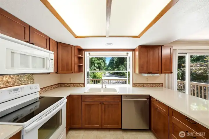 Another shot of kitchen looking out to the drive coming in to the property.