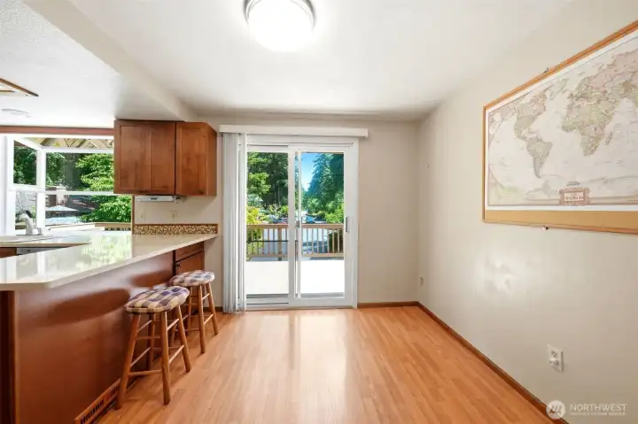 Kitchen with slider looking out to front deck.