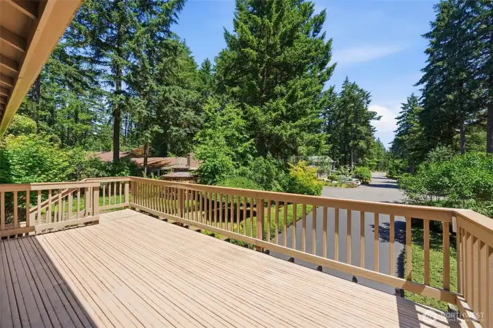 Big front deck off kitchen with steps leading down to front entry.
