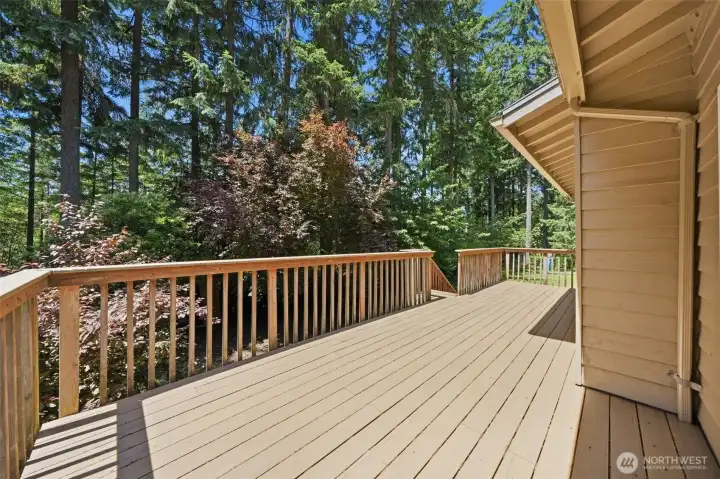 Spacious back deck off dining room with steps going down to back yard.