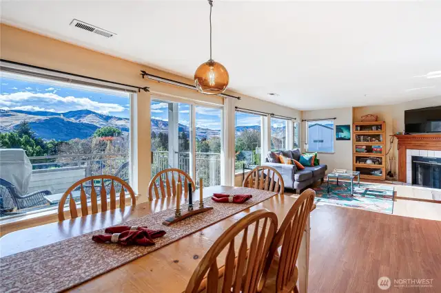 Dining area opens to deck with BBQ and living area has an uplake view window