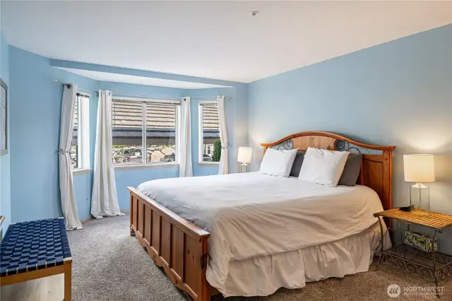 Spacious primary bedroom with king bed