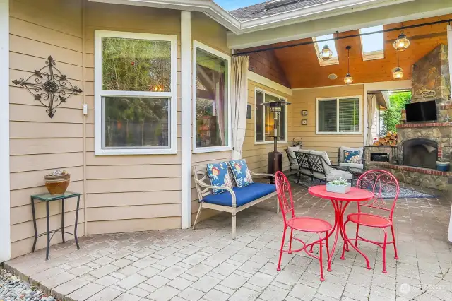 Amazing outdoor living area with built in fireplace, bbq, fridge, skylights and surround sound.