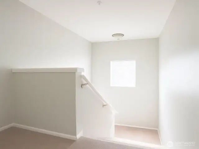 Looking down toward the lower level—a peaceful and open layout with room for all.