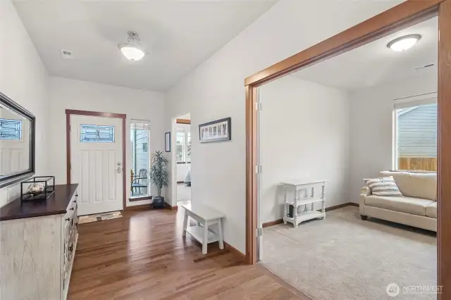 front entry hall. 2 bedrooms on this side of the house and the primary bedroom is on the other side of the house.