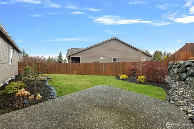 Back/side yard. Extended back patio for BBQ's and furniture. HOA takes care of the landscape, sprinklers and fence.