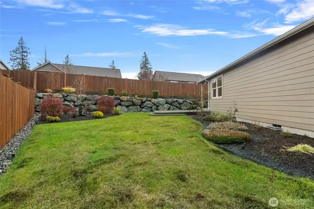 Side yard on the north. Fully fenced back yard!