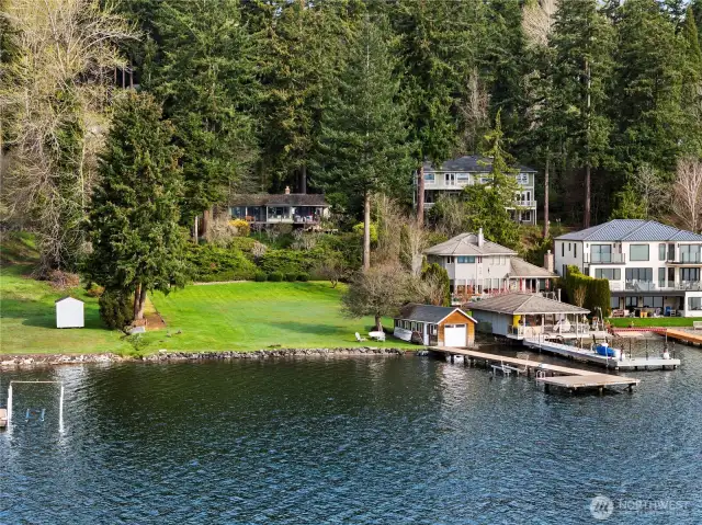Spectacular waterfront acreage with incredible 119 feet of coveted south-facing Juanita Bay waterfront!