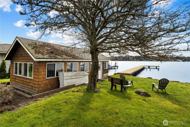Waterside boat house with rails to the water