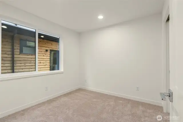 A perfectly-sized bedroom or flex space—guest room, gym, or hobby hideaway? You decide.