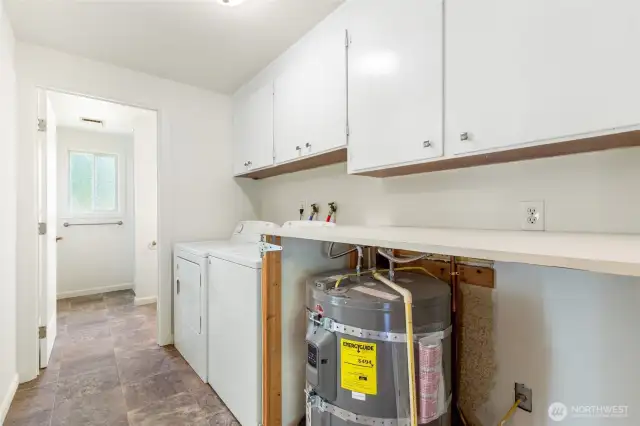 Utility room off of kitchen with .75 bath