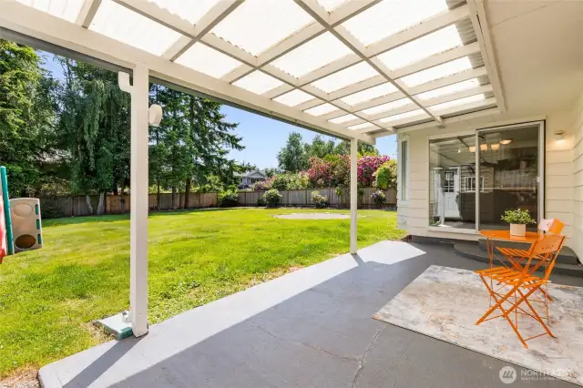 Covered patio overlooking the fully fenced back yard