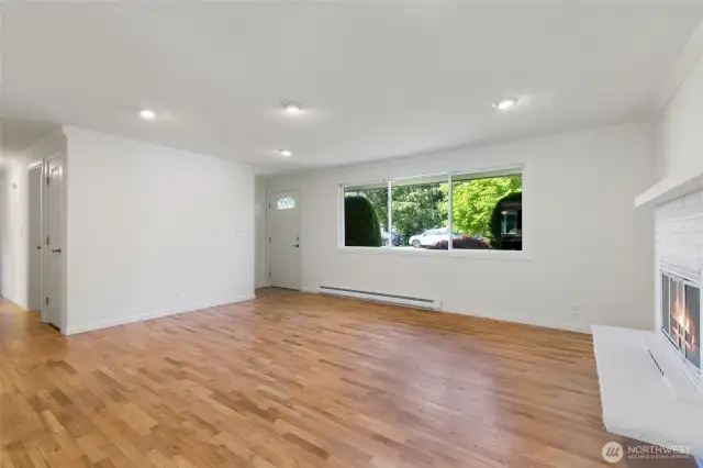 Hardwood flooring and large picture window