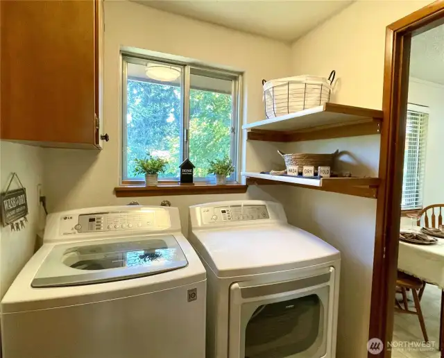 Light & bright laundry room with storage, washer & dryer included!
