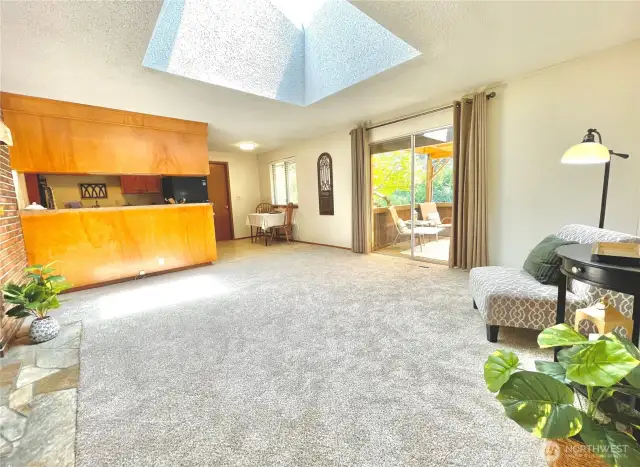 Family room with easy outdoor access to covered patio & fully fenced backyard.