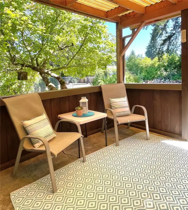 Cute covered back patio for convenient outdoor entertaining.