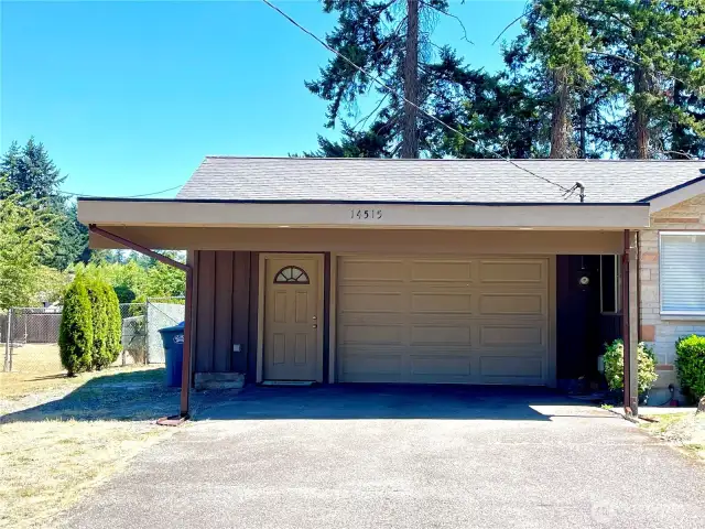 Carport parking for 2 vehicles, easy access to garage and home.