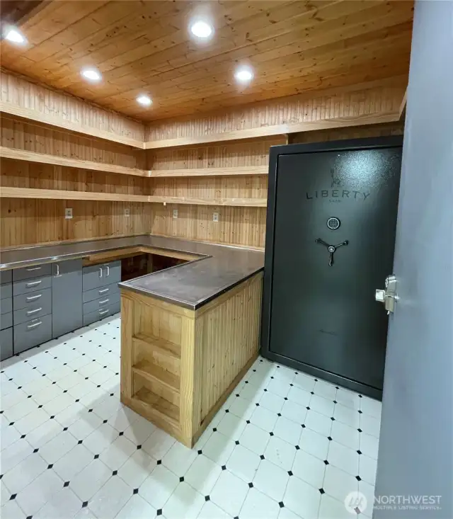 Safe room with heat, lighting and a huge safe that conveys with property sale.