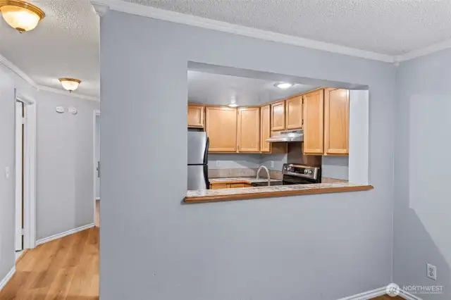 Open and airy layout with convenient pass-through window connection the kitchen and dining area - perfect for entertaining and everyday living.