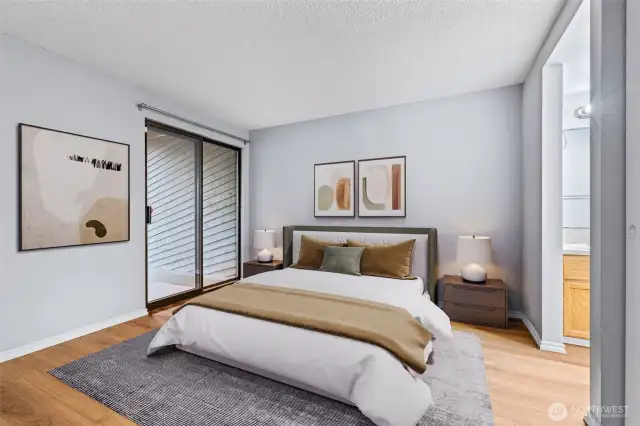 Primary bedroom with door to patio. Virtually staged.
