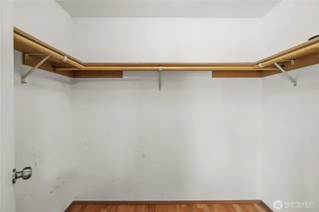 Spacious walk-in closet for ample storage.
