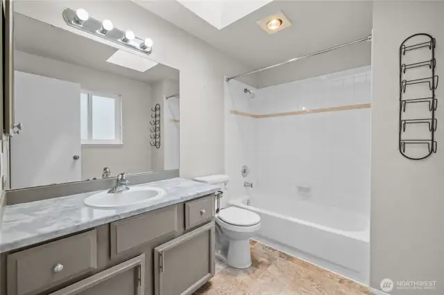 Updated bathroom with modern finishes.