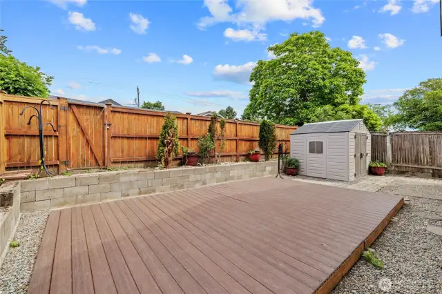 Fully fenced backyard with storage shed & alley access.
