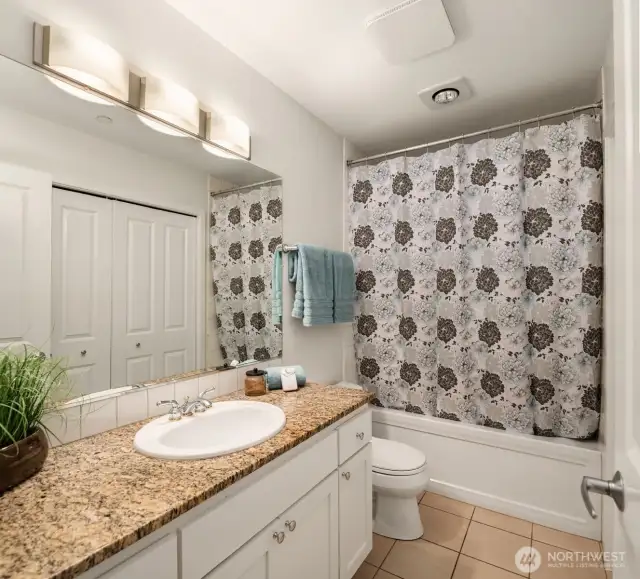 Full bathroom features a beautiful and deep soaking tub!