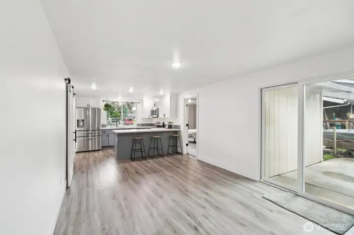 Great room with sliding glass door leading to the backyard