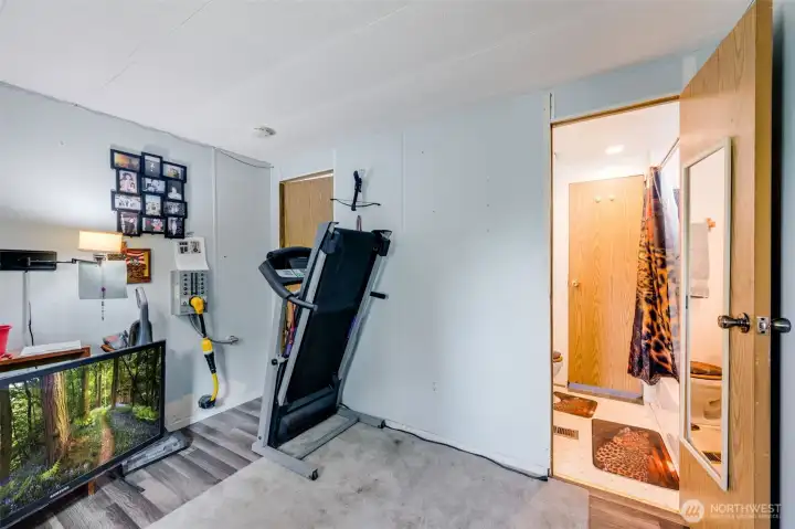 Bedroom 2 with a view of the guest full bathroom. New electrical all throughout!