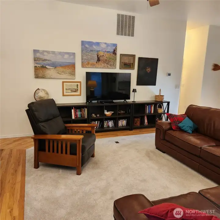 A large wall can hold all of your entertainment equipment and still have room for art or photographs.