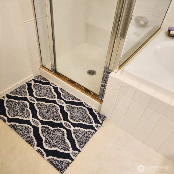 Glass doors in the shower let the light in.