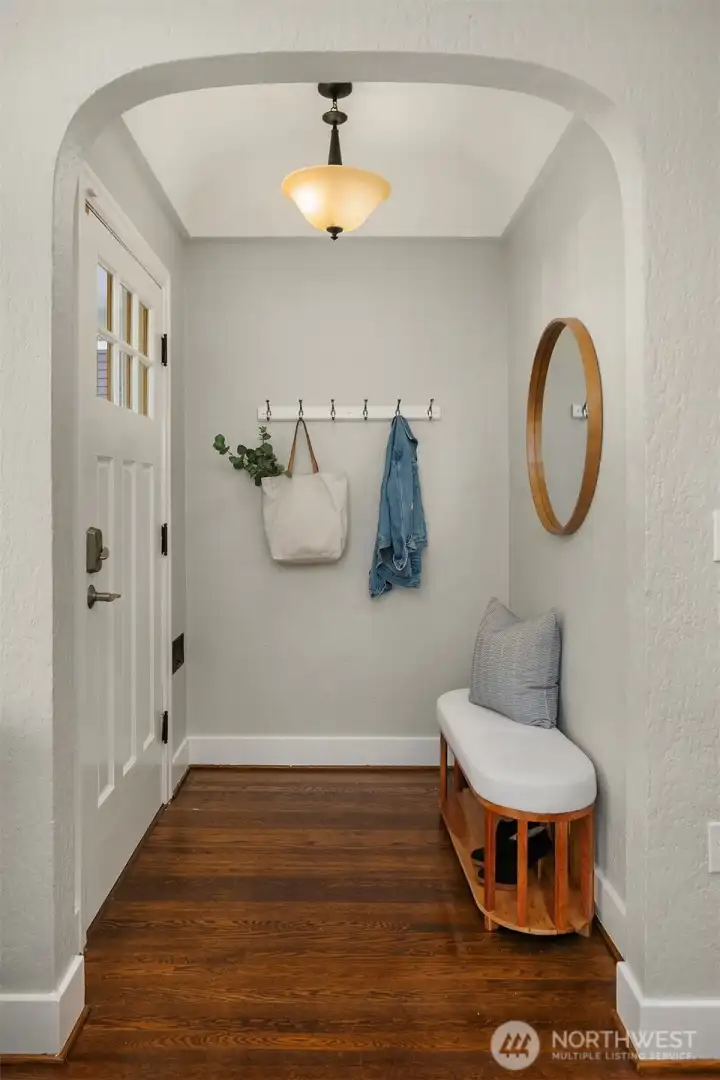 Coved ceilings and welcoming formal entry.