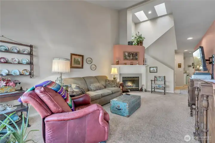 Soaring vaulted ceilings and natural light with skylights.
