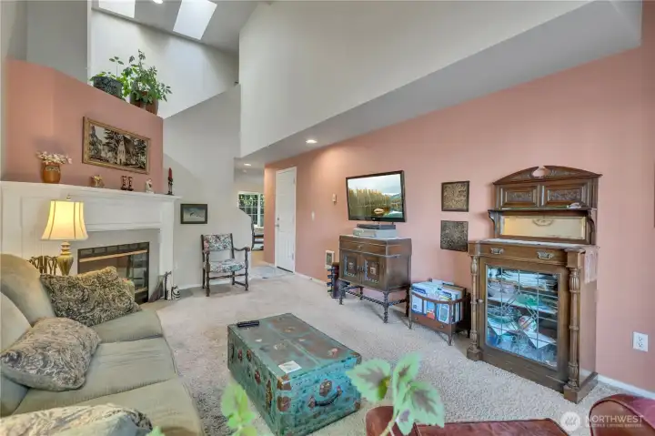 Beautiful lines in this front room and a cozy wood fireplace.