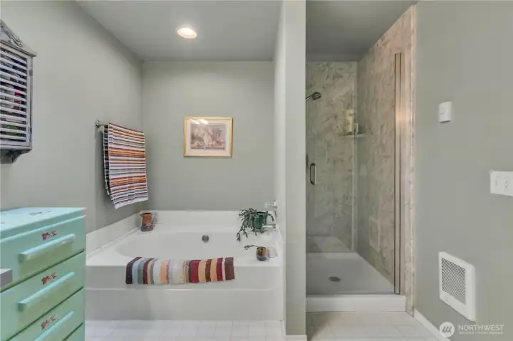 There's so much room you can put a dresser in the primary bathroom!