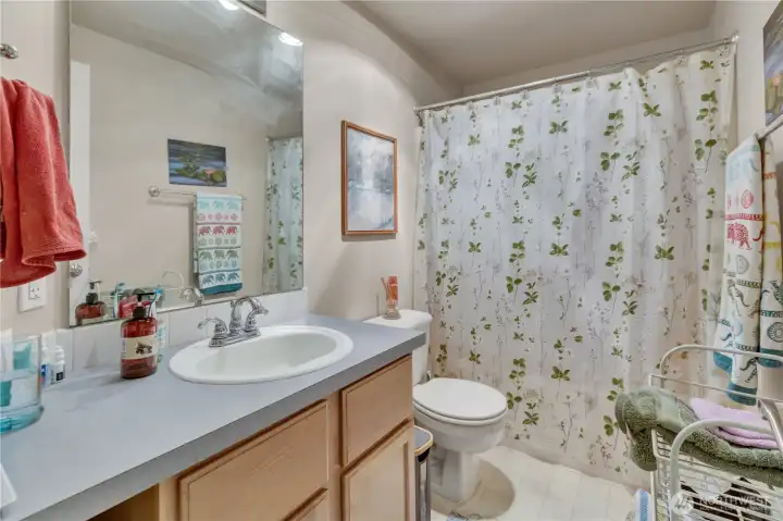The hall bath services the other 2 bedrooms.