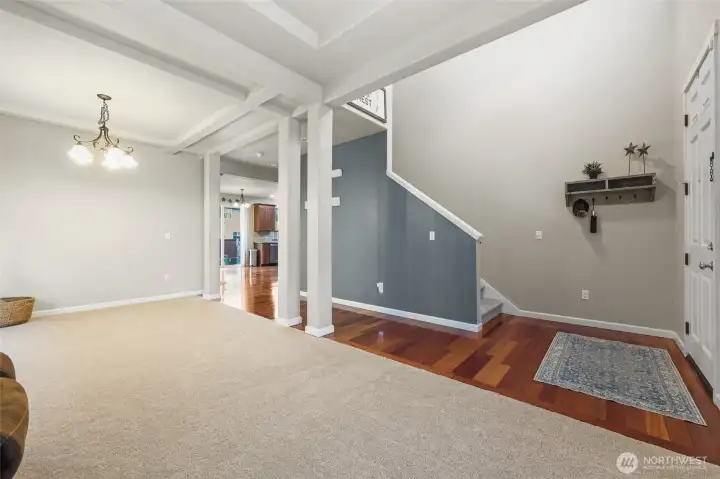 Brand new carpet throughout the house! Coffered ceilings and posts bring an elevated style to this formal dining and living room area.