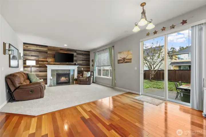 Open to kitchen and nook, this is the space where family and friends come together. Natural light abounds with the tall windows and large slider.