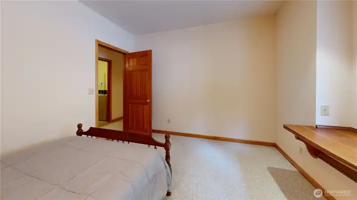 2nd bedroom with beautiful wood table top