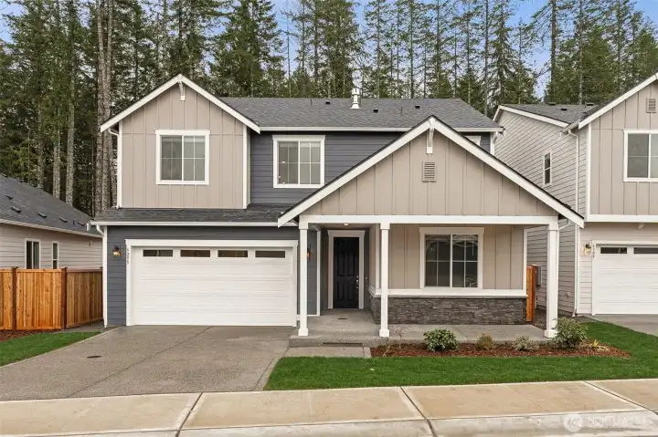 Photo of similar home, actual home has a 3 car garage model only