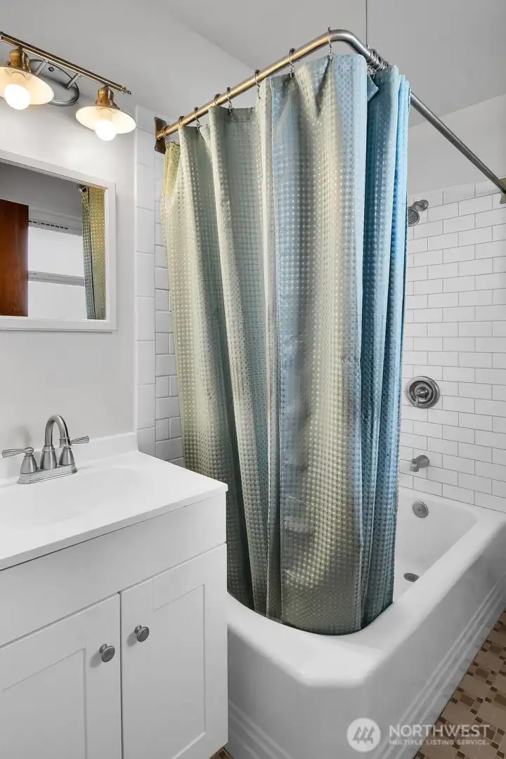 Bathroom with tile backsplash.