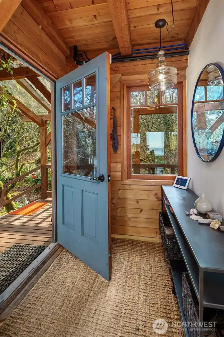 Welcome to 12825 SW Ober Beach Road. A custom true timber frame home built in the French style by a meticulous island craftsman as his own home.