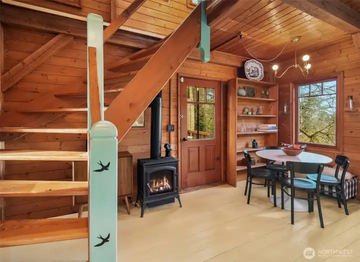 Propane stove for cozy evenings. Door leads out onto spacious deck.